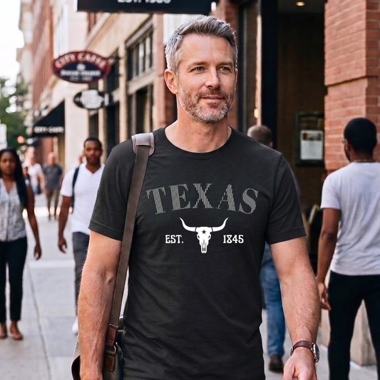 Man wearing a black 'Texas' t-shirt on a city street