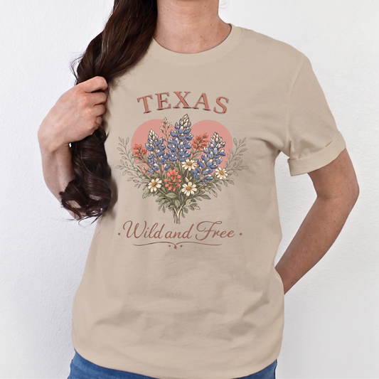 Beige t-shirt with 'Texas Wild and Free' design featuring flowers on a white background