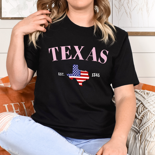 Person wearing a black t-shirt with 'TEXAS' and a map of Texas design.